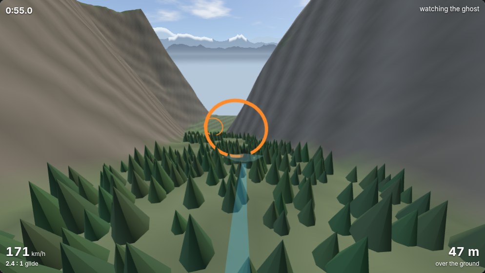 The Gully in the Wingsuit game on a clear day: steep grey valley walls, a ring ahead over the trees, and snowy blue ranges under a blue sky