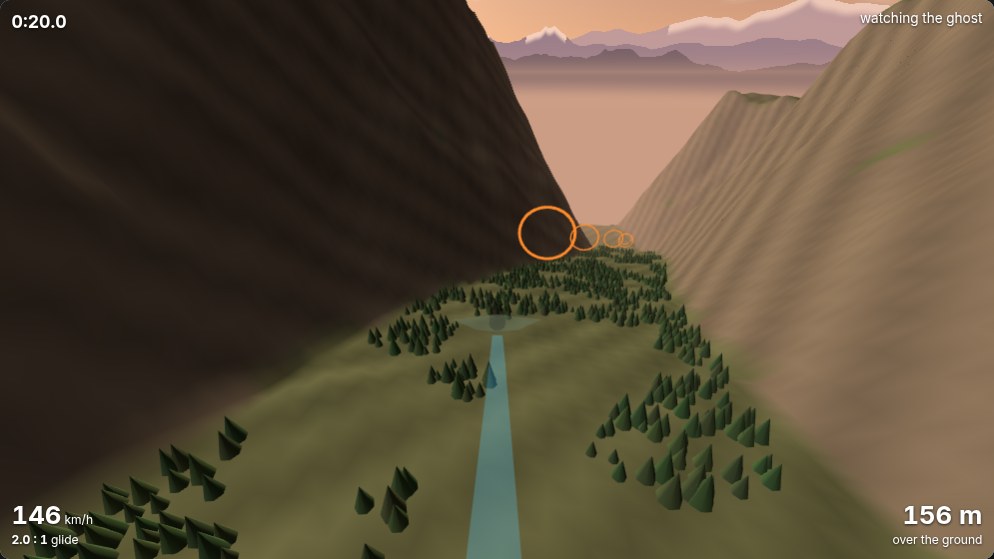 The Valley in the Wingsuit game at dusk: a green valley floor with trees, orange rings leading away down it, and violet mountain ranges with snow on their peaks fading into a peach sky